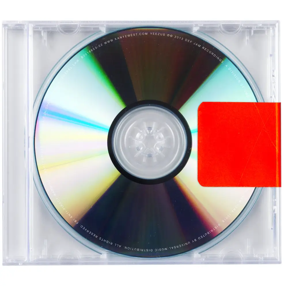 Silver CD in clear jewel case with red square sticker. Kanye West "Yeezus" cover art.