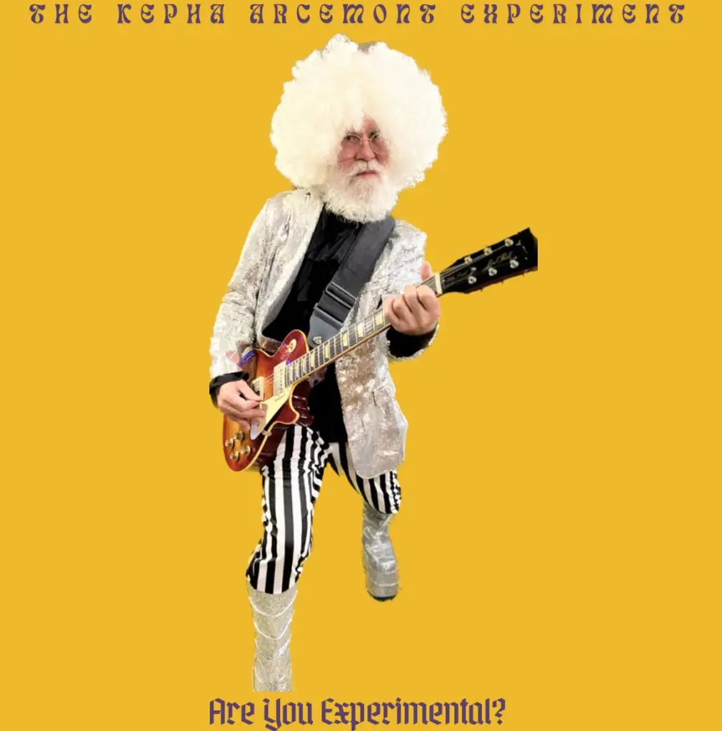 Album-style cover with a person in a silver jacket, striped pants, and large white wig playing electric guitar on a mustard background; text reads ‘The Kepha Arcemont Experiment’ and ‘Are You Experimental?'
